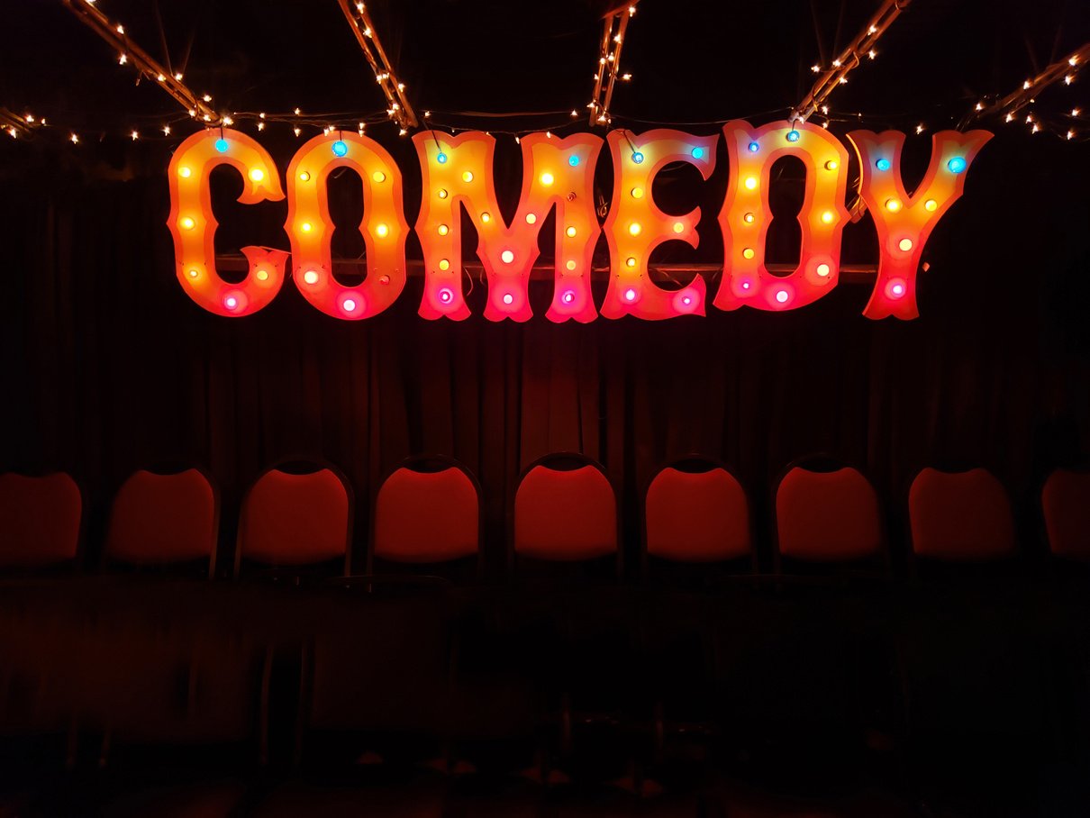 Comedy Sign with Theater Seats